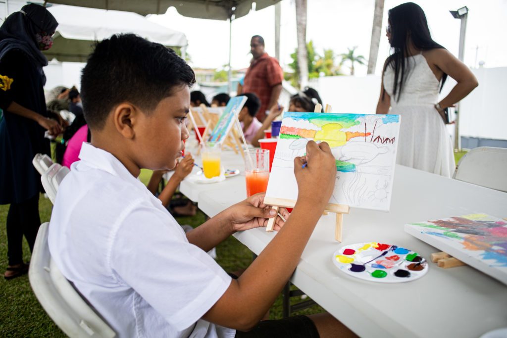 Students creating environmental artwork at a club session